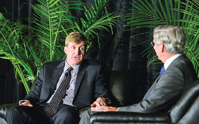 Photo of Patrick Kennedy and Jeffrey Lieberman, M.D., conversing on a stage.