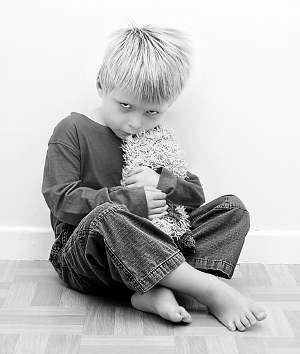 Photo of A solitary child with autism spectrum disorder. 