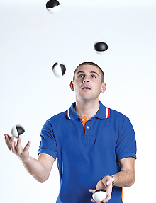 Photo: Man juggling.