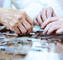 Photo: People putting together a puzzle
