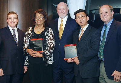 Photo: Saul Levin, M.D., M.P.A., chair of the American Psychiatric Association Foundation’s Board of Directors and APA CEO and medical director; Marie-Claude Rigaud, M.D., M.P.H., of Rebâti Santȳ Mentale; Paul Burke, executive director of the Foundation; XinQi Dong, M.D., M.P.H., of Rush University Medical Center; and James Nininger, M.D., a member of the Foundation’s Board of Directors.