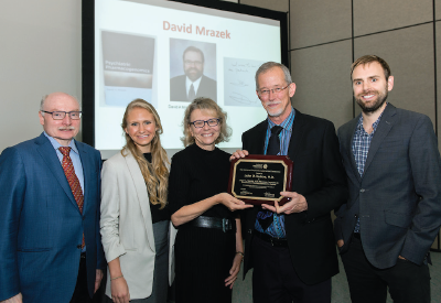 Photo: Mrazek Award winner John Kelsoe, M.D. (second from right), is photographed with (from left) James Kennedy, M.D., who chaired Kelsoe’s lecture, and family members of the psychiatrist after whom the award is named: daughter Alissa Mrazek, Ph.D., wife Patricia Mrazek, Ph.D., and son Michael Mrazek, Ph.D.