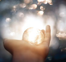 Photo: Person holding light ball