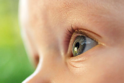 Photo: Close up of a young child’s eye.