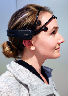 Photo of Sydney Smith wearing an EEG headset.