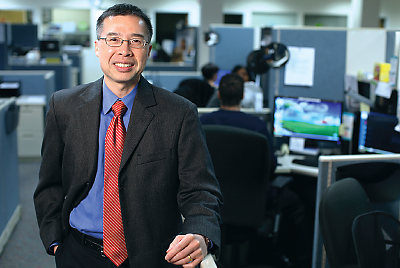 Photo: Henry Chung, M.D. standing in office.