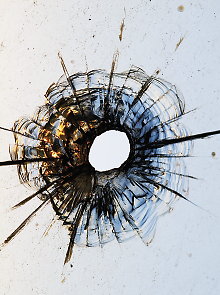 Photo: Bullet hole in a glass
