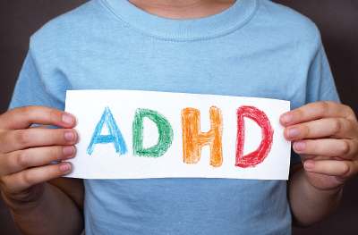 Photo: Person holding ADHD sign