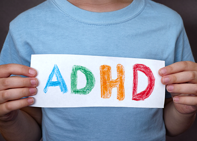 Photo: Child holding ADHD sign