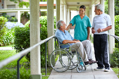 Photo: Nursing home residents chatting with a nurse