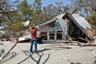 Photo: Person with destroyed house