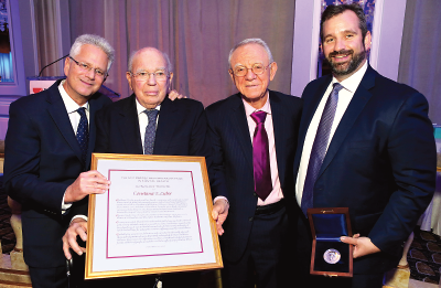 Photo: BBRF President and CEO Jeffrey Borenstein, M.D. (left), and Scientific Council President Herbert Pardes, M.D. (second from right), recognize 2017 Pardes Humanitarian Prize recipients Jason Cone (right, accepting on behalf of Doctors Without Borders) and Stephen Lieber (second from left, accepting on behalf of the late Constance Lieber).