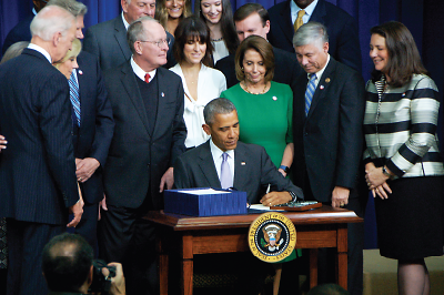 Photo: President Barack Obama at White House signs H.R. 34, 21st Century Cures Act, into law.