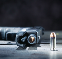 Photo: Gun and bullet
