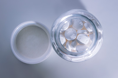 Photo: aspirin pills on white background
