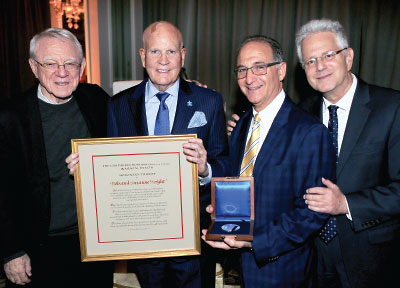 Photo: Herbert Pardes, M.D., president of the BBRF Scientific Council (left) and BBRF President and CEO Jeffrey Borenstein, M.D. (right), stand with Bob Wright, winner with his wife (now deceased) of the 2018 Honorary Pardes Humanitarian Prize, and Judge Steven Leifman, winner of the 2018 Pardes Humantarian Prize.