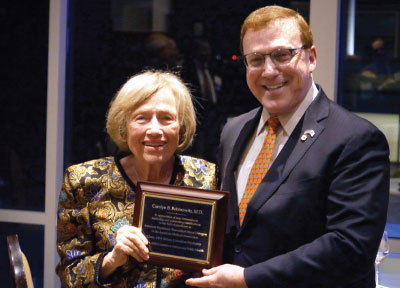 Photo: APA CEO and Medical Director Saul Levin, M.D., M.P.A., presents Carolyn Robinowitz, M.D., with a plaque