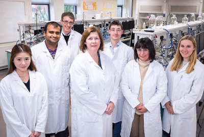 Photo: Sarah Bailey, Ph.D. (center), and her lab