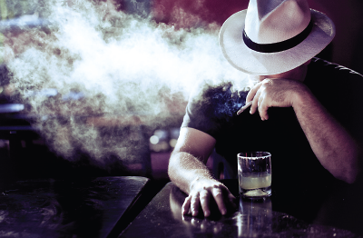 Photo: Man smoking and drinking
