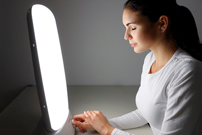Photo: woman receiving light therapy