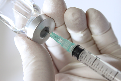 Photo: filled vials and syringe