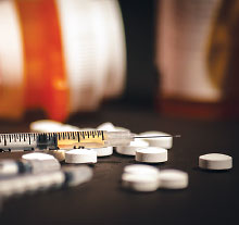 Photo: Pills and syringe