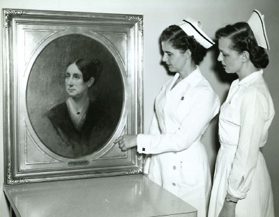 Photo: Nurses at St. Elizabeths Hospital in Washington, D.C., stand beside a portrait of Dorothea Dix