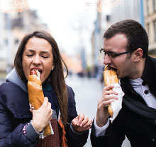 Photo: Guy and girl eating sandwiches