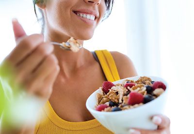 Photo: Woman eating healthy food