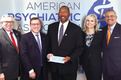 Photo: Rahn Kennedy Bailey, M.D., with a $5,000 contribution.