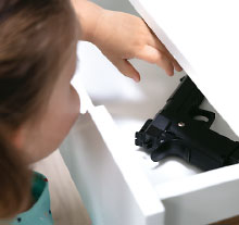 Photo: Child reaching for gun