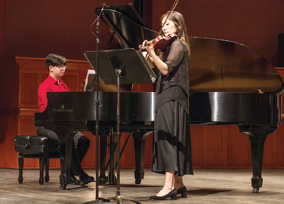 Photo: Grace Ro performing at the Rutgers New Jersey Medical School Convocation in May 2019