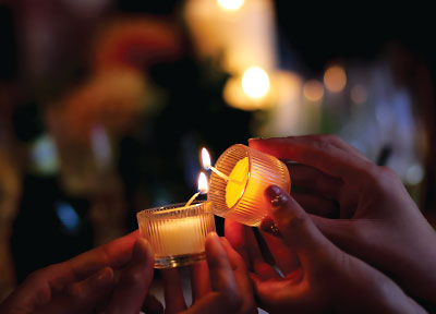 Photo: hands to lighting up candles