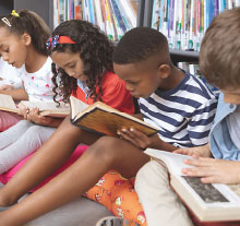 Photo: Minority Children reading books