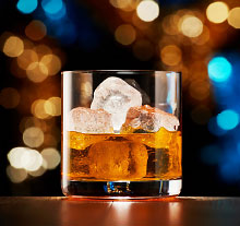 Photo: glass of alcoholic beverage with ice