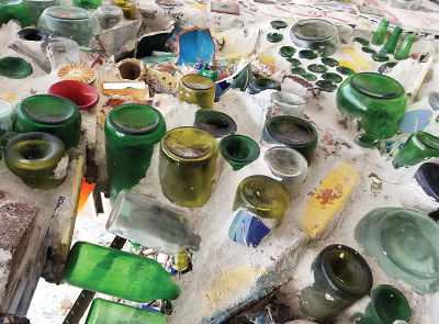 Painting: Bottles and dishes combine for a stunning mosaic at Philadelphia’s Magic Gardens.