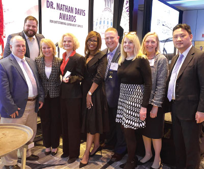 Photo: Nora Volkow, M.D. (fourth from left), is joined by psychiatrists, AMA and APA leaders, and APA staff