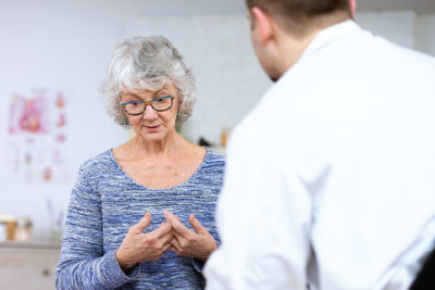 Photo: Senior Lady consulting with a doctor