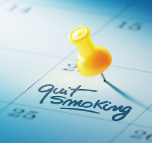 Photo: Yellow pin on a calendar with "quit smoking" written on