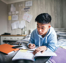Photo: Boy studing a book