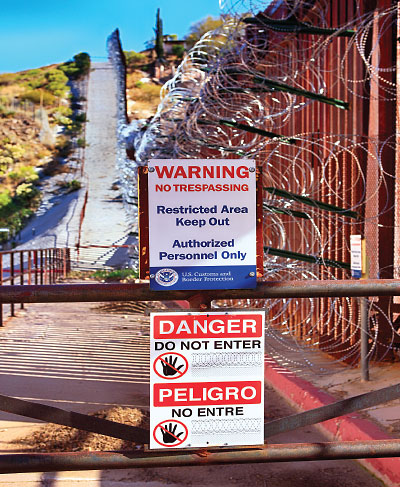 Photo: border area with warning and danger signs