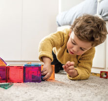 Photo: toddler playing with blocks