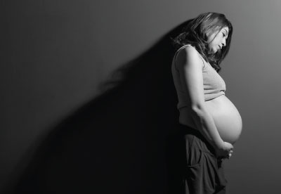 Photo: Pregnant woman with a sad face