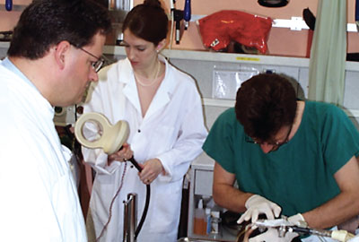 Photo: Sarah Lisanby, M.D., prepares to administer magnetic seizure therapy to the first human volunteer in 2000.