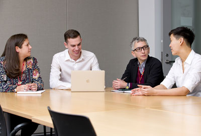 Photo: (from left) Jessica Spellun, M.D., Matthew Wickersham, Jess Zonana, M.D., and Constance Zhou hold a strategy session.