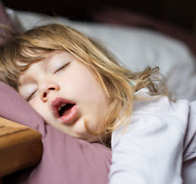 Photo: young child sleeping with the mouth open