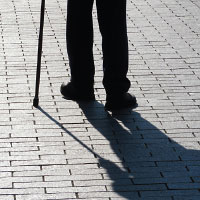 Photo: man walking with a cane