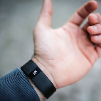 Photo: forearm with movement tracking device