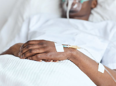 Photo: man on a hospital bed