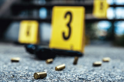 Photo: Gun and bullet cases in a crime scene